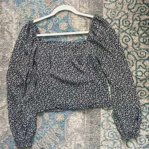 Black with white floral design off the shoulder or on Abercrombie & Fitch top.